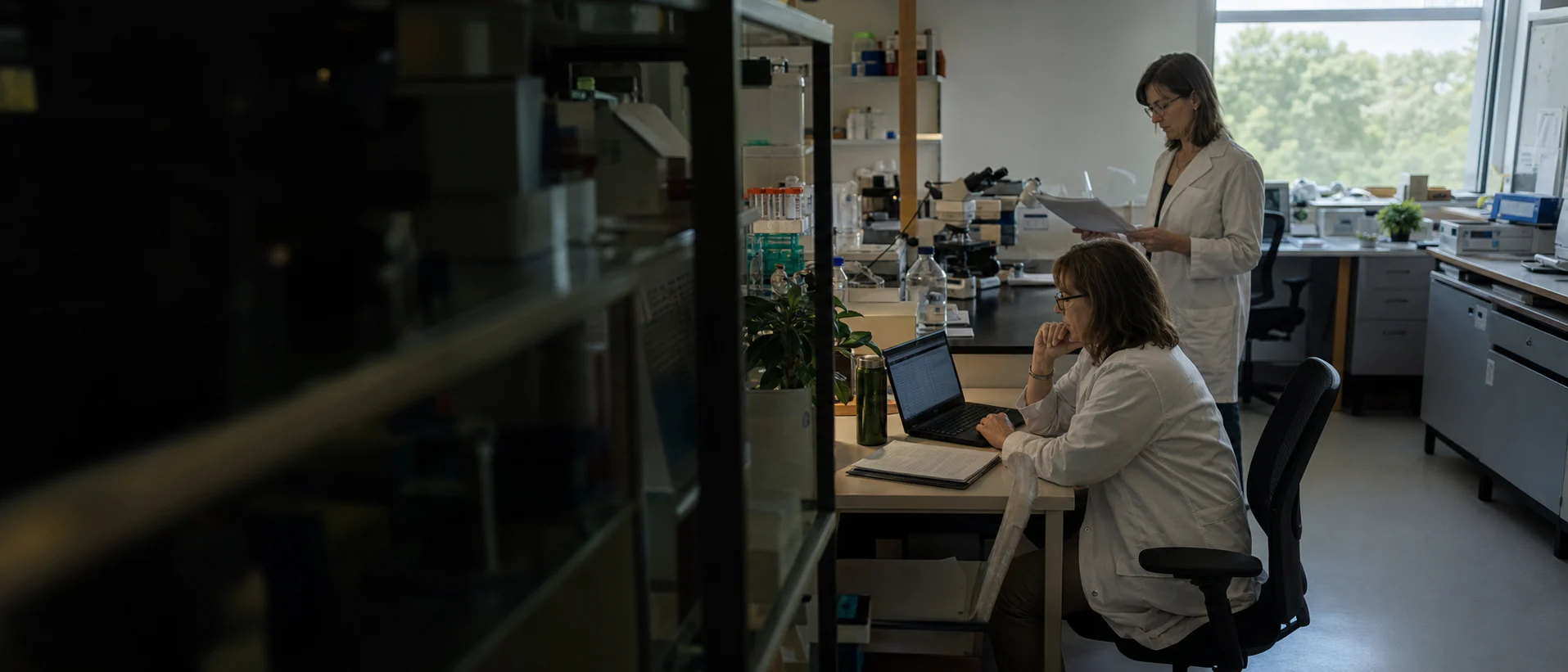 Clinical researchers reviewing study data in a working laboratory